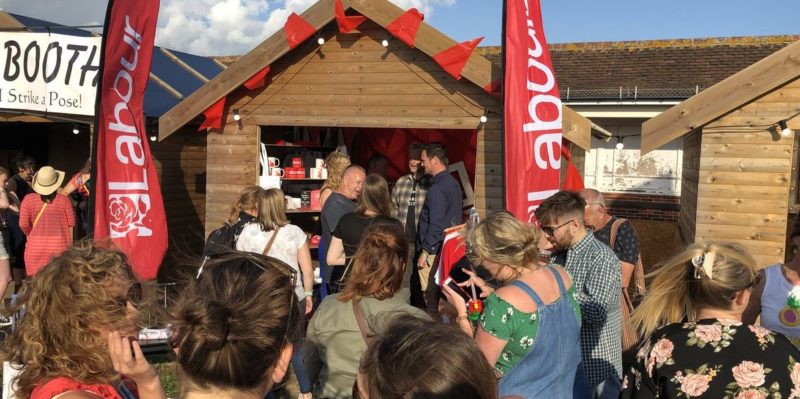 Festival goers check out the Labour stall